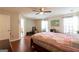 Spacious bedroom featuring hardwood floors, natural light and adjoining bathroom at 2545 Lake Royale Dr, Riverdale, GA 30296
