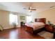Spacious bedroom featuring hardwood floors, natural light and ceiling fan at 2545 Lake Royale Dr, Riverdale, GA 30296