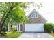 Charming home with a stone facade and a well-manicured front lawn at 2545 Lake Royale Dr, Riverdale, GA 30296