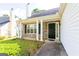 Inviting front porch with stone accents and manicured landscaping at 2545 Lake Royale Dr, Riverdale, GA 30296