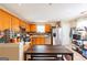 Well-appointed kitchen with stainless steel appliances, wooden cabinets, and a tile backsplash, for culinary adventures at 2545 Lake Royale Dr, Riverdale, GA 30296