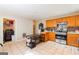 Functional kitchen with wooden cabinets, stainless steel appliances, and tile floors, designed for convenience at 2545 Lake Royale Dr, Riverdale, GA 30296