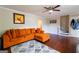Comfortable living room with stairs, hardwood floors and a ceiling fan, making it a cozy space at 2545 Lake Royale Dr, Riverdale, GA 30296