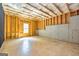 Unfinished basement with exposed insulation, wood frames, and a small window at 500 Barrington Farms Pkwy, Sharpsburg, GA 30277