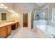 Bathroom showcases a soaking tub, a glass shower, and double vanities at 500 Barrington Farms Pkwy, Sharpsburg, GA 30277