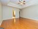 Bedroom with hardwood floors, tray ceiling and doorways to other rooms at 500 Barrington Farms Pkwy, Sharpsburg, GA 30277