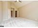 Empty bedroom featuring a ceiling fan and neutral carpeting at 500 Barrington Farms Pkwy, Sharpsburg, GA 30277