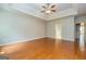 Bedroom with wood floors, trey ceiling, fan and doorways to other rooms at 500 Barrington Farms Pkwy, Sharpsburg, GA 30277