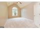 Bright bedroom with vaulted ceiling and a large window with backyard view at 500 Barrington Farms Pkwy, Sharpsburg, GA 30277