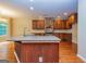 Spacious kitchen with granite countertops, wood cabinets, and stainless steel appliances at 500 Barrington Farms Pkwy, Sharpsburg, GA 30277