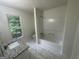 Bright bathroom featuring a tub/shower and granite countertop at 56 Ridgewood Ct, Mcdonough, GA 30252