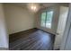 This bright bedroom features modern floors and ample natural light, creating a comfortable and inviting atmosphere at 56 Ridgewood Ct, Mcdonough, GA 30252