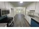 Open kitchen featuring modern appliances, sleek countertops, and an eat-in breakfast nook area with backyard views at 56 Ridgewood Ct, Mcdonough, GA 30252