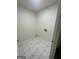 Tiled laundry room ready for new appliances at 56 Ridgewood Ct, Mcdonough, GA 30252