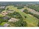 Aerial view of a well-maintained home with lush landscaping, mature trees, and a manicured front lawn at 406 Horizon Trl, Canton, GA 30114