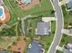 Aerial view of a home's meticulously landscaped backyard, complete with mature trees and a cozy patio at 406 Horizon Trl, Canton, GA 30114