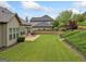 Well-maintained backyard featuring a manicured lawn and cozy patio, perfect for outdoor entertaining at 406 Horizon Trl, Canton, GA 30114