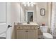 Bathroom with a vanity with traditional style cabinets, granite countertop and toilet at 406 Horizon Trl, Canton, GA 30114