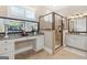 Bright primary bathroom with double vanity, granite countertop, and glass shower at 406 Horizon Trl, Canton, GA 30114