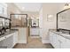 Spacious primary bathroom with double vanities, granite countertops, and tile shower at 406 Horizon Trl, Canton, GA 30114