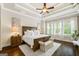 Cozy bedroom with ample natural light, hardwood floors, and stylish décor at 406 Horizon Trl, Canton, GA 30114