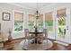 Dining area with modern chandelier and views of outdoor space at 406 Horizon Trl, Canton, GA 30114
