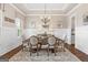 Charming dining room with wainscoting, tray ceiling, and elegant chandelier at 406 Horizon Trl, Canton, GA 30114