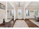 Bright foyer with hardwood floors, white wainscoting and views to the dining room at 406 Horizon Trl, Canton, GA 30114
