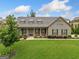 Stunning one-story home featuring stone accents, dormer windows, and a well-maintained lawn at 406 Horizon Trl, Canton, GA 30114