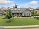 Charming one-story home with well-manicured lawn and stone accents create an inviting curb appeal at 406 Horizon Trl, Canton, GA 30114