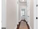 Hallway with dark hardwood floors and white trim at 406 Horizon Trl, Canton, GA 30114
