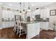 Spacious kitchen with a large island, granite countertops, and stainless appliances at 406 Horizon Trl, Canton, GA 30114