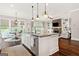 Open-concept kitchen with granite island, stainless appliances, and hardwood floors at 406 Horizon Trl, Canton, GA 30114