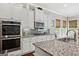 Modern kitchen with stainless steel appliances and granite countertops at 406 Horizon Trl, Canton, GA 30114