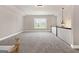 Large loft with neutral carpet, plantation shutters, and ample space for activities at 406 Horizon Trl, Canton, GA 30114