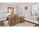Comfortable home office with custom built-in desk, plantation shutters, and dark hardwood floors at 406 Horizon Trl, Canton, GA 30114