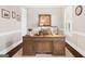 Cozy home office with a large wooden desk, plantation shutters, and neutral decor at 406 Horizon Trl, Canton, GA 30114