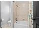 Bathroom features a ceramic tile surround and shower head at 4595 Carriage Walk Ln, Cumming, GA 30040