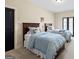 Bedroom with neutral walls, black doors, carpet, and two twin beds at 4595 Carriage Walk Ln, Cumming, GA 30040