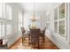 Bright dining area with natural light and seating for four at 4595 Carriage Walk Ln, Cumming, GA 30040