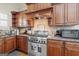 Close up of a kitchen featuring stainless appliances and granite countertops at 4595 Carriage Walk Ln, Cumming, GA 30040