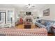 Bright living room with stone fireplace and comfortable seating area at 4595 Carriage Walk Ln, Cumming, GA 30040