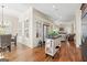 Open-concept kitchen and dining area with a clear view of the living area at 4595 Carriage Walk Ln, Cumming, GA 30040