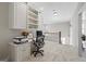 Upstairs office area with built in bookshelves and lots of natural light at 4595 Carriage Walk Ln, Cumming, GA 30040