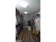 Spacious walk-in closet with hardwood floors and extensive shelving and hanging storage at 219 Brown Branch Rd, Locust Grove, GA 30248