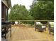 Outdoor deck with grill and stylish seating area, perfect for entertaining guests and enjoying outdoor cooking at 219 Brown Branch Rd, Locust Grove, GA 30248