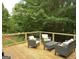 Relaxing outdoor deck with stylish seating area, perfect for entertaining guests or enjoying serene moments at 219 Brown Branch Rd, Locust Grove, GA 30248