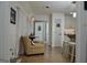 A view through doorway into the dining room and the kitchen with hardwood flooring at 219 Brown Branch Rd, Locust Grove, GA 30248