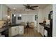 Well-lit kitchen featuring a breakfast bar, pendant lighting, and seamlessly flowing into the dining area at 219 Brown Branch Rd, Locust Grove, GA 30248