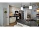 A bright kitchen featuring white cabinets, stainless steel appliances, pendant lights, and an undermount sink at 219 Brown Branch Rd, Locust Grove, GA 30248